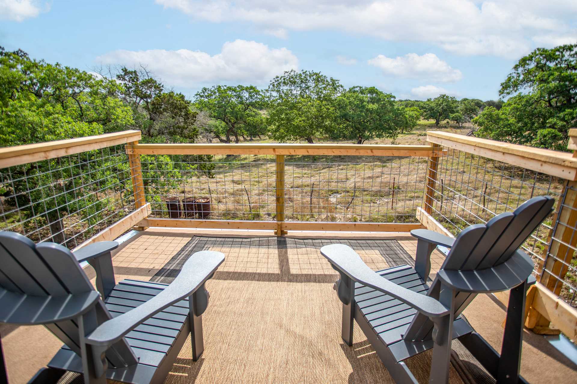 Balcony with two chairs and a view