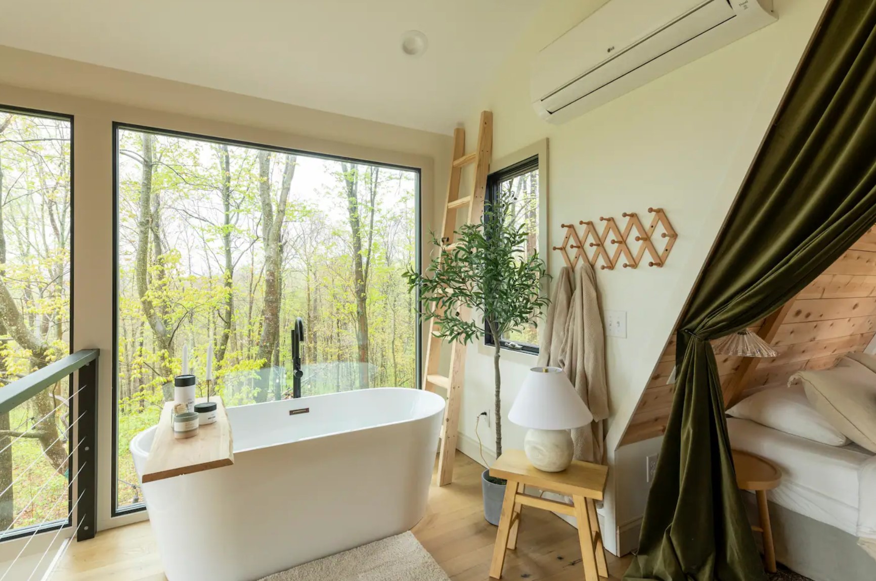 Bathtub in a room with a large window