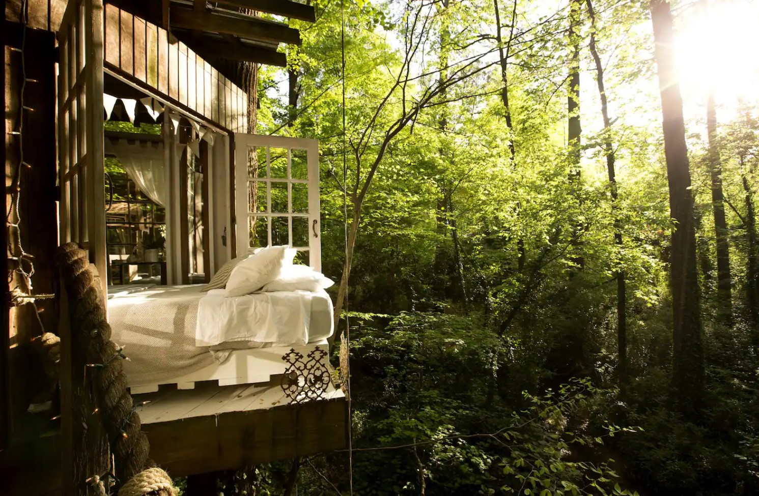 Bed on a balcony in the trees