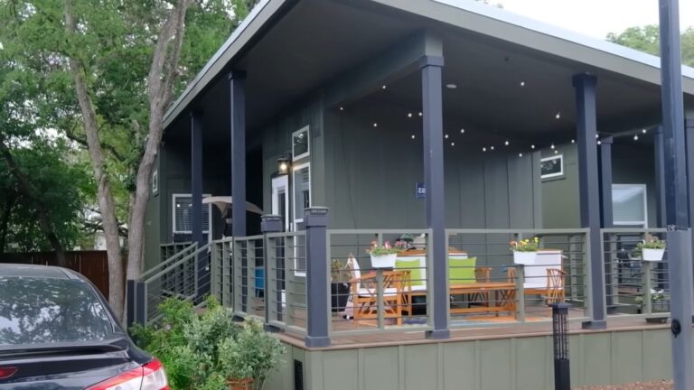 exterior of a tiny home with a wraparound deck