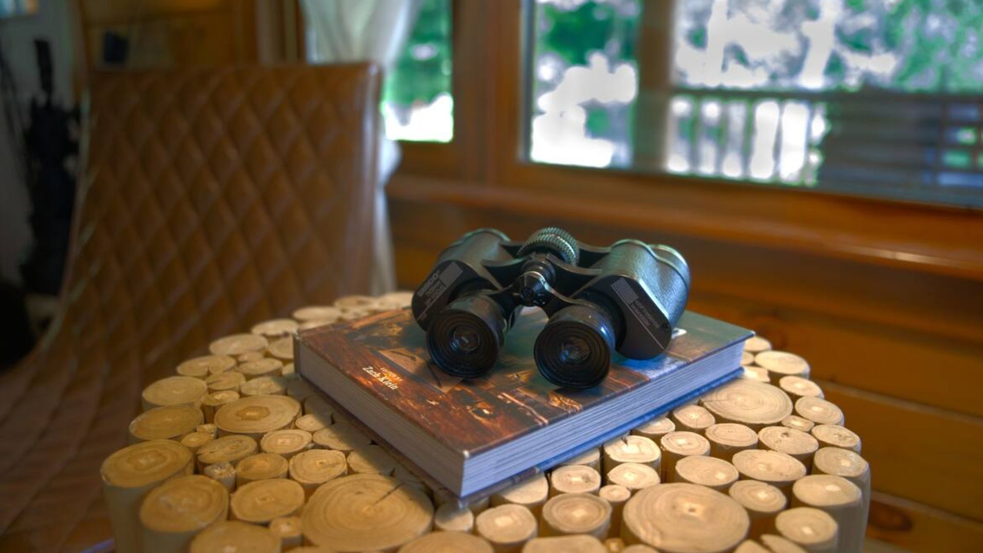 wooden table with binoculars on it