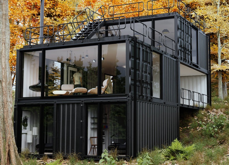 black shipping container home built on a hill