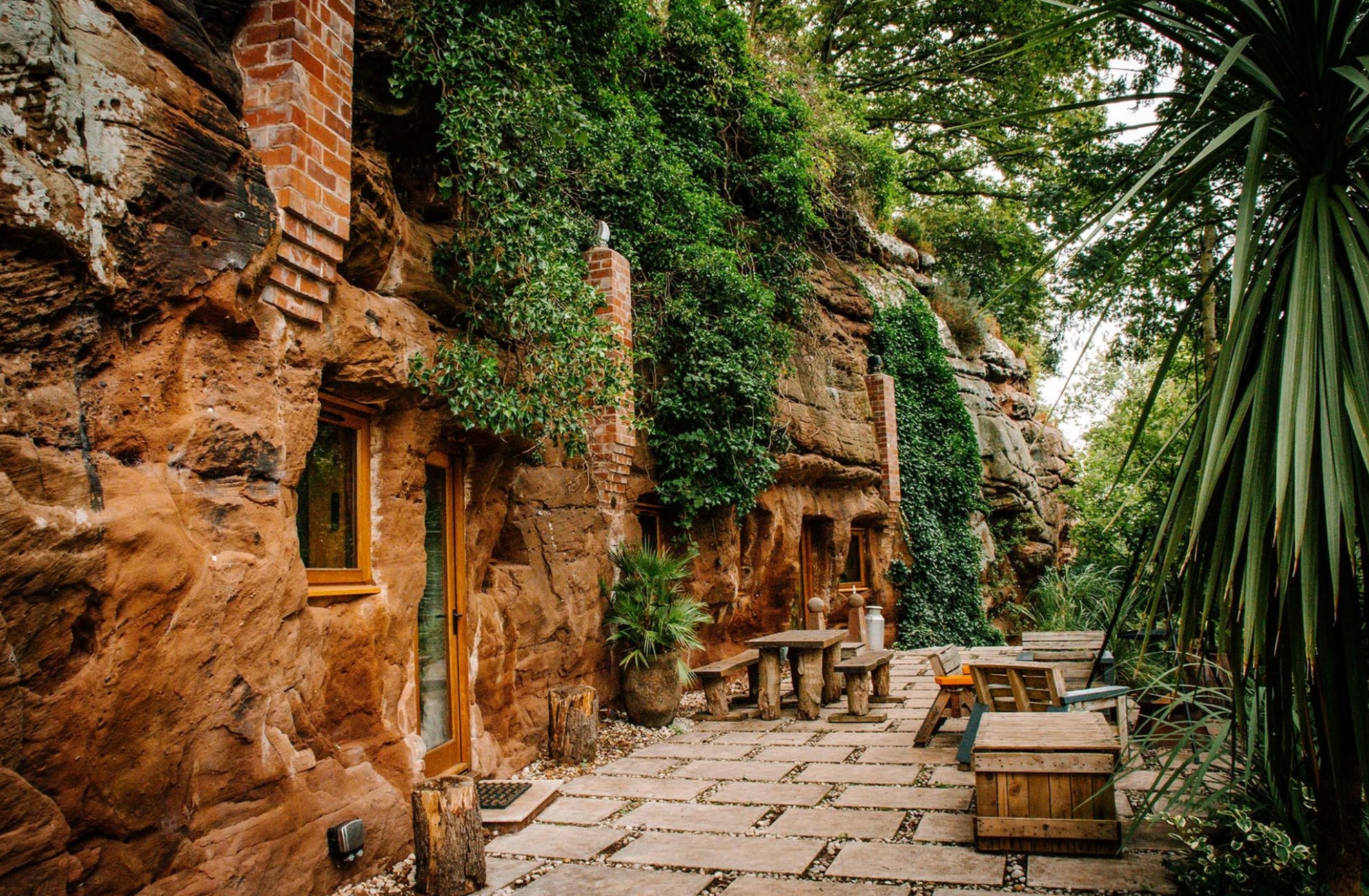 Orange cave home in nature with lounge area