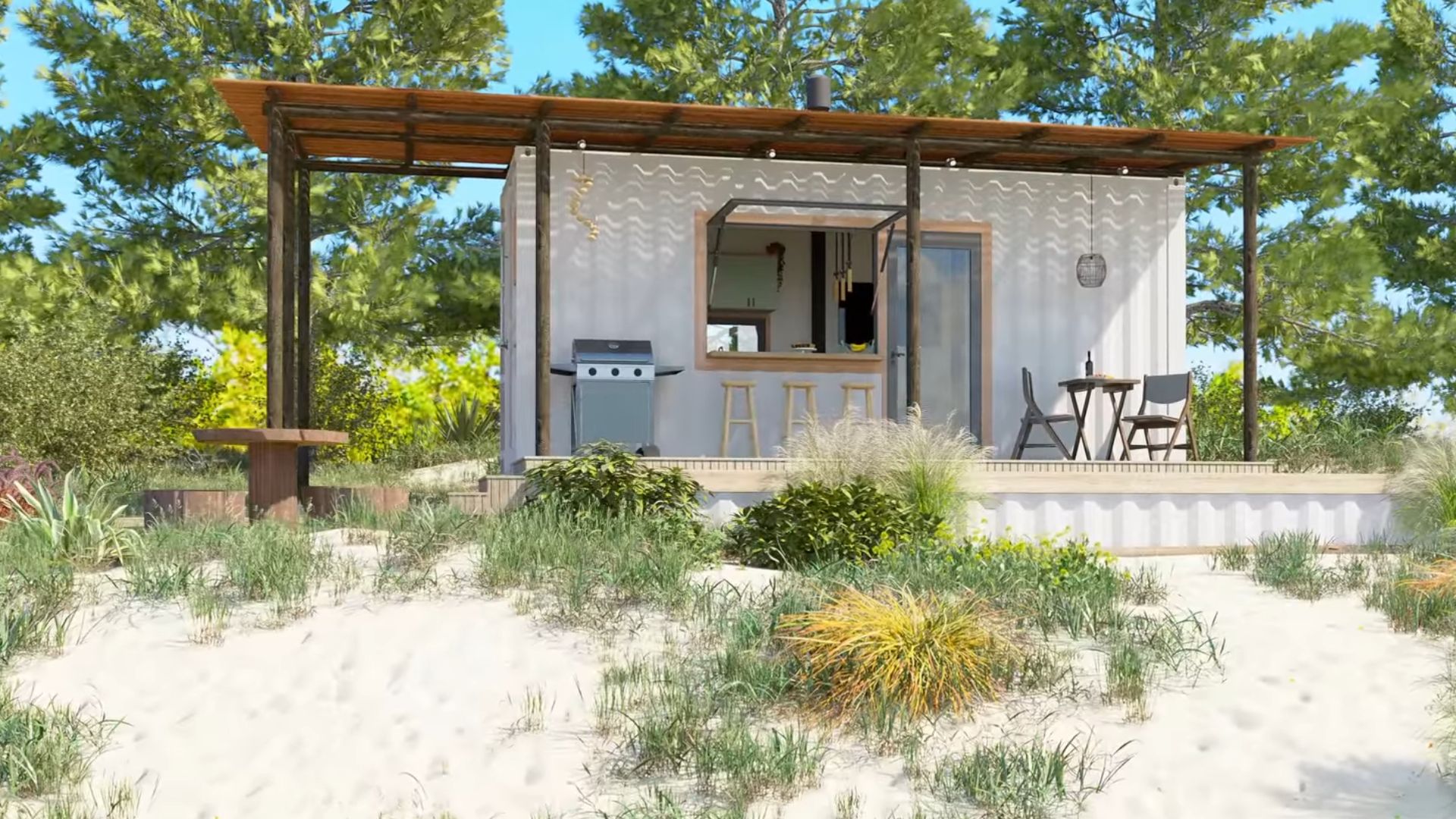 exterior of a container house with bar stools in front of a window, a grill, and two chairs around a table