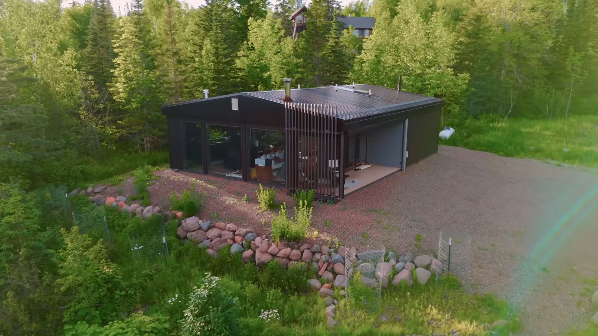 exterior of a container house in the woods