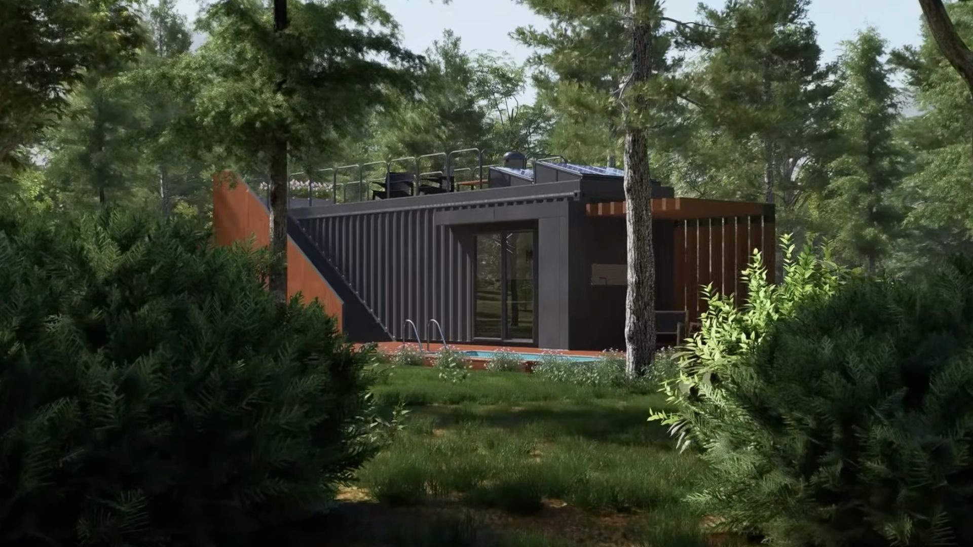 black container house surrounded by lots of greenry