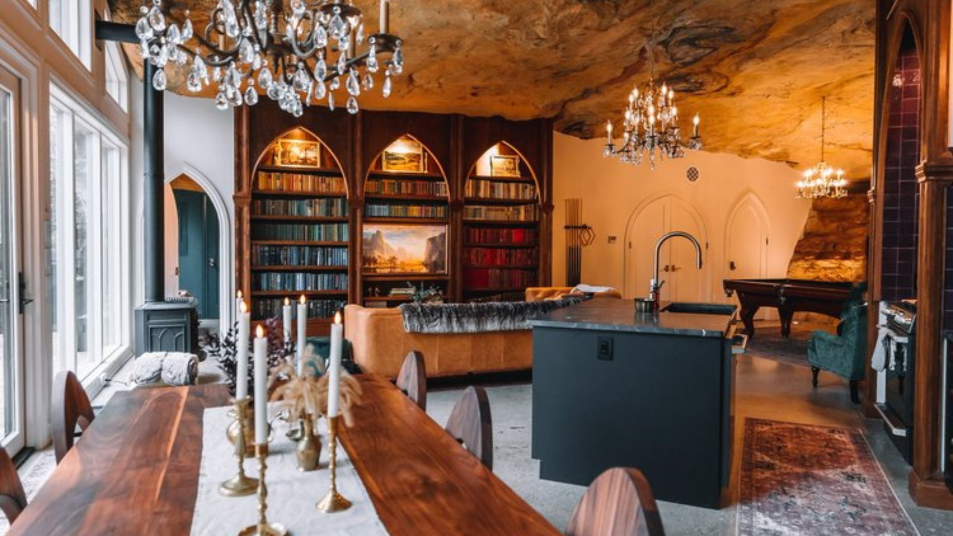 inside a hobbit cave home with dining room on the left and library in the back