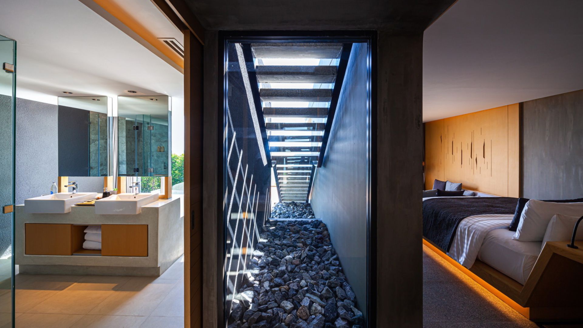 beautiful stone tunner with light playing inside between the bedroom and bathroom