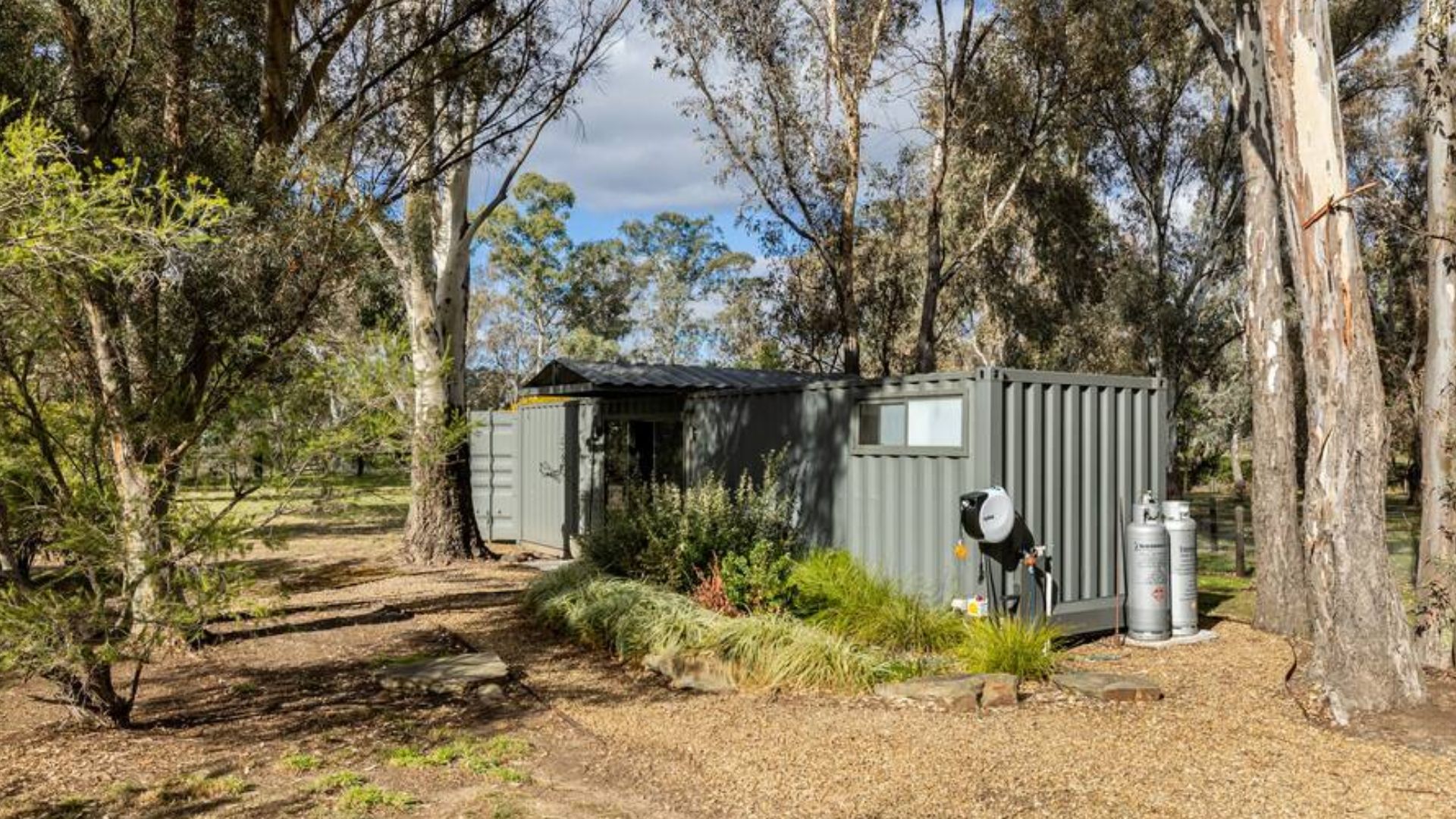 Luxurious shipping container with an incredible backyard