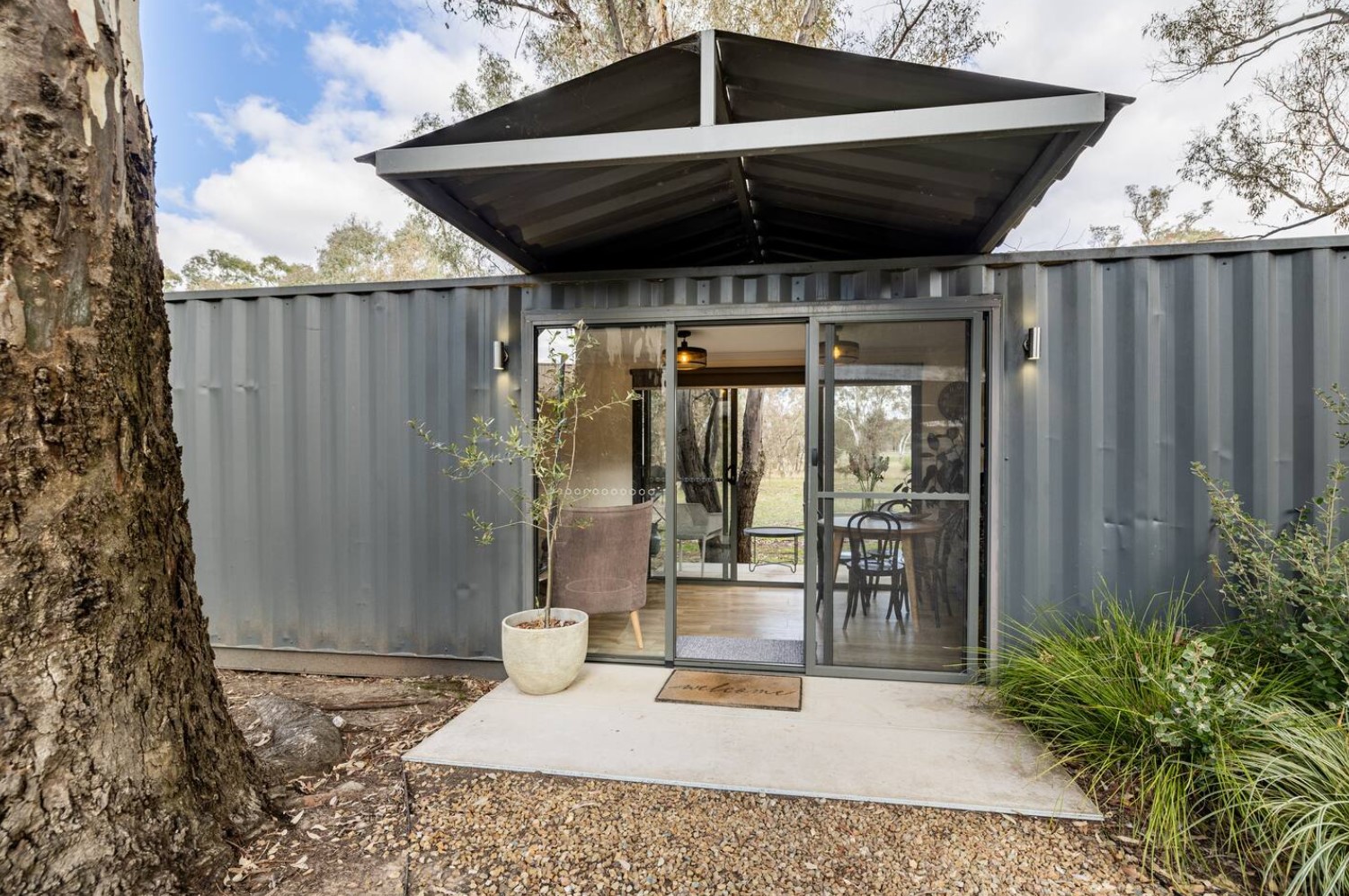 Main entrance to container home with sliding doors