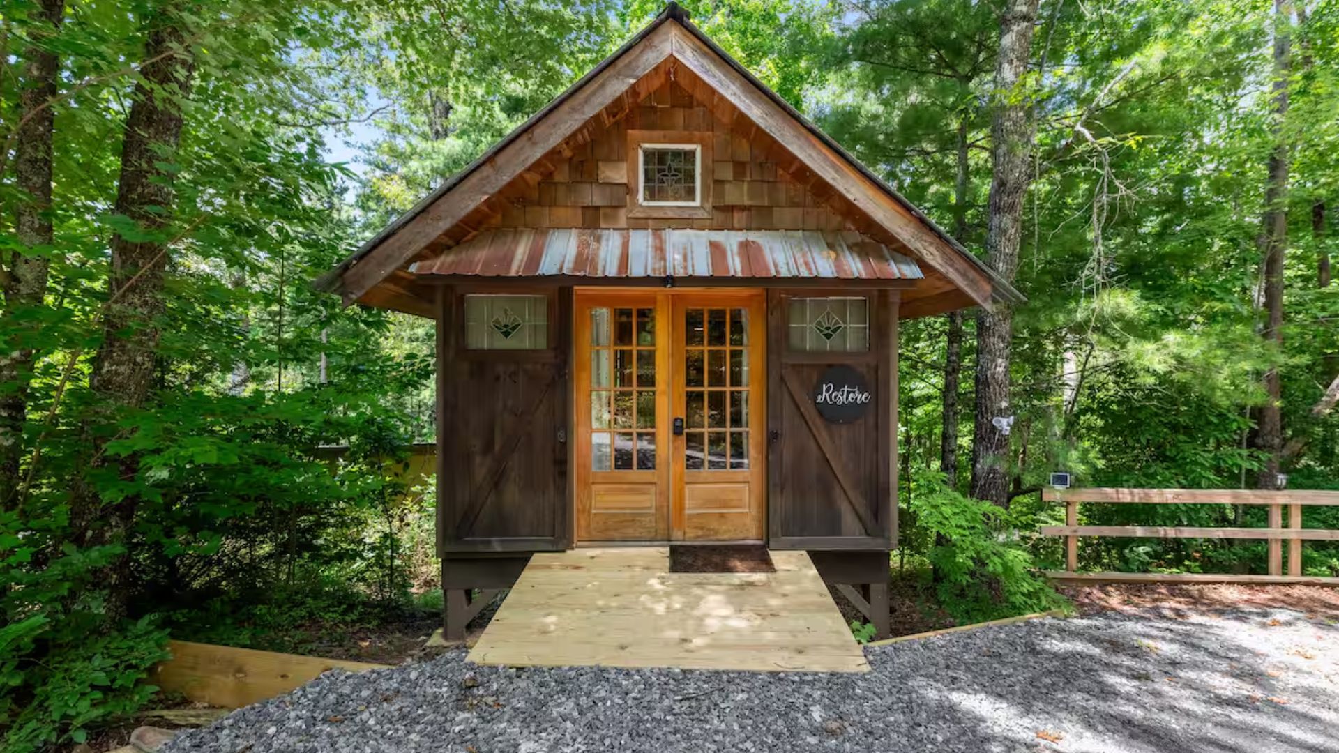 exterior of a tiny cabin in the woods