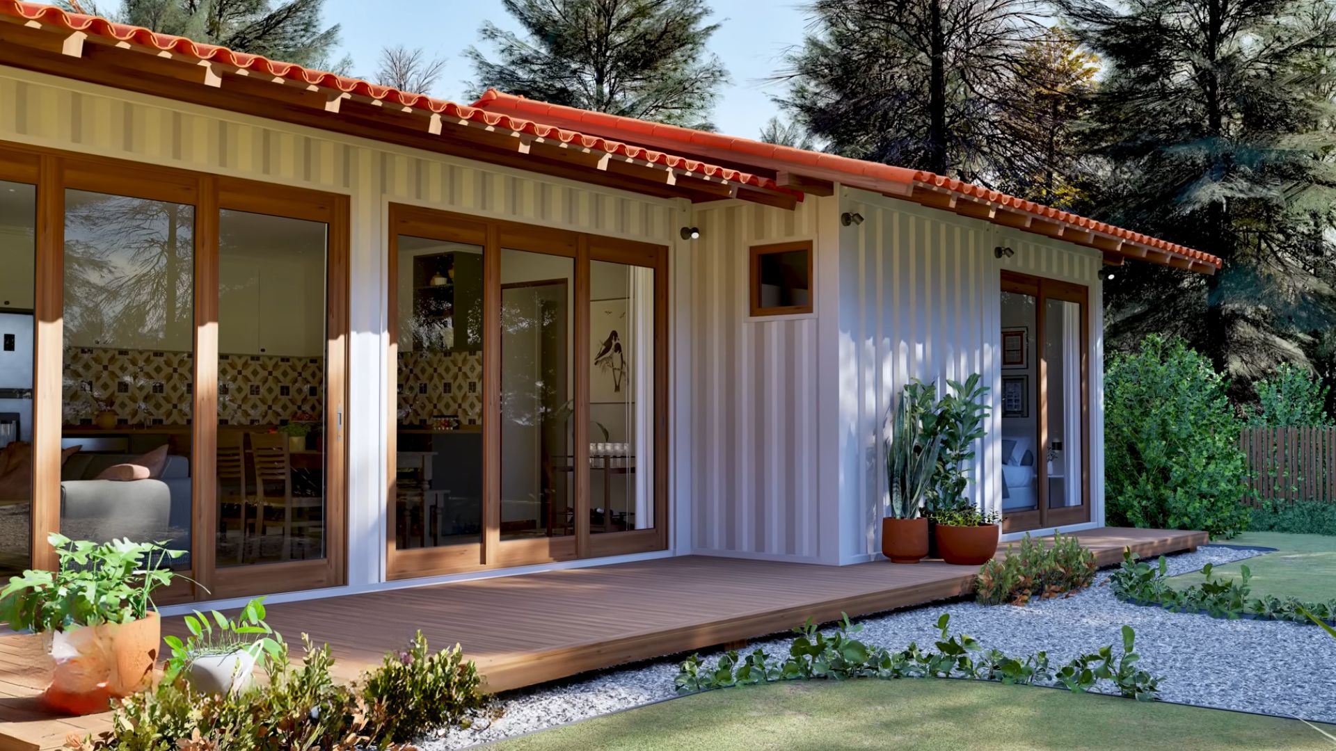 exterior of the family container home with picturesque windows, lots of plants and flowers in the front of the house, woods int he back, white facade with a reddish roof