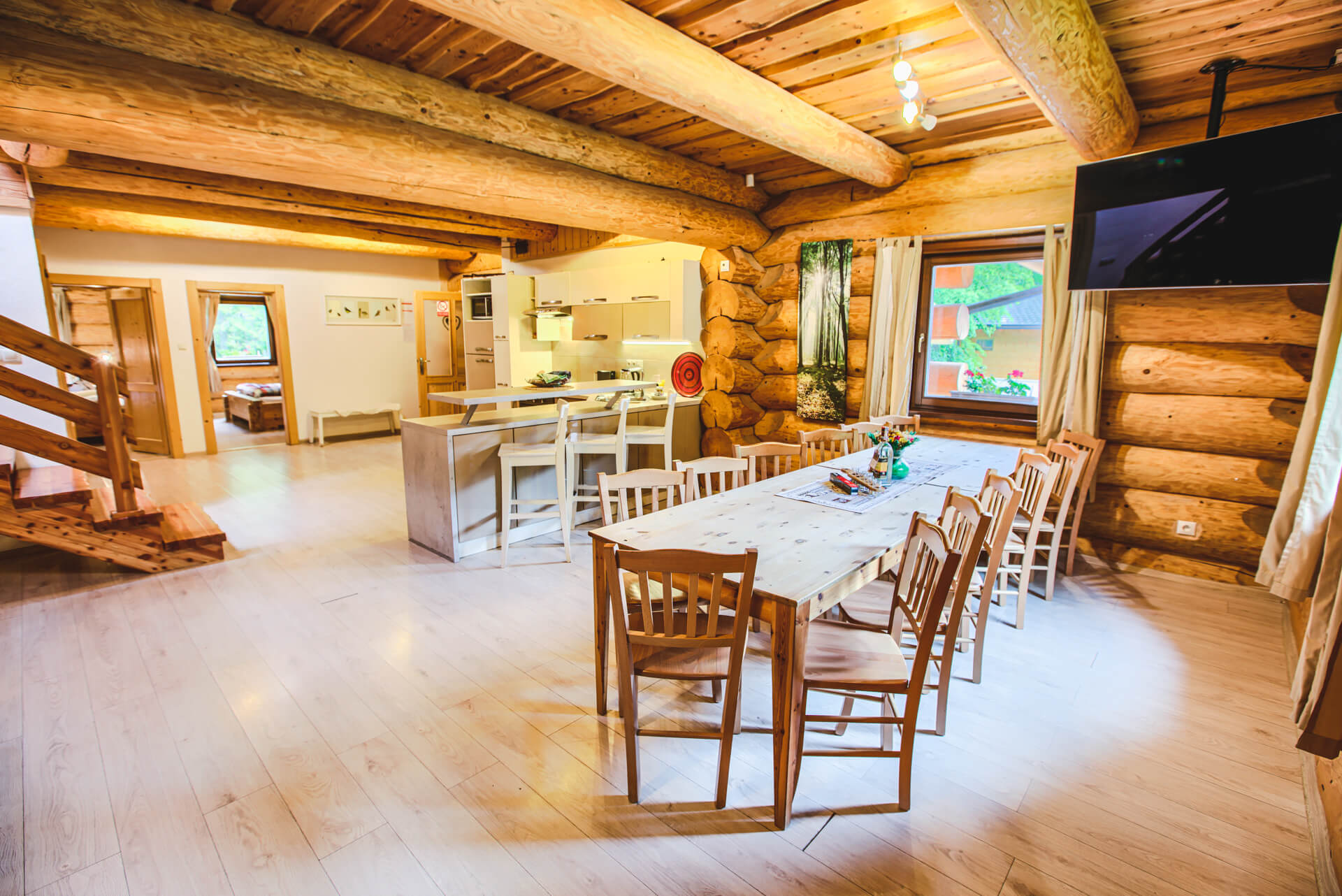 Huge dining room in cabin with a TV