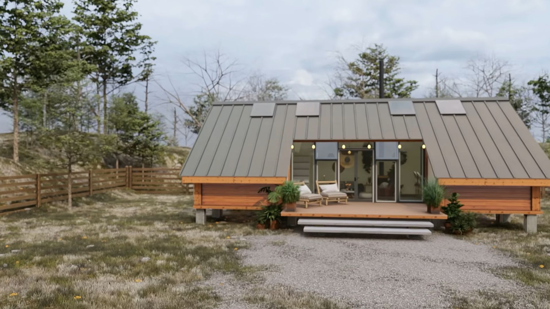 close up photo of the exterior of the tiny cozy container house with a small deck and two slanted ends of the roof