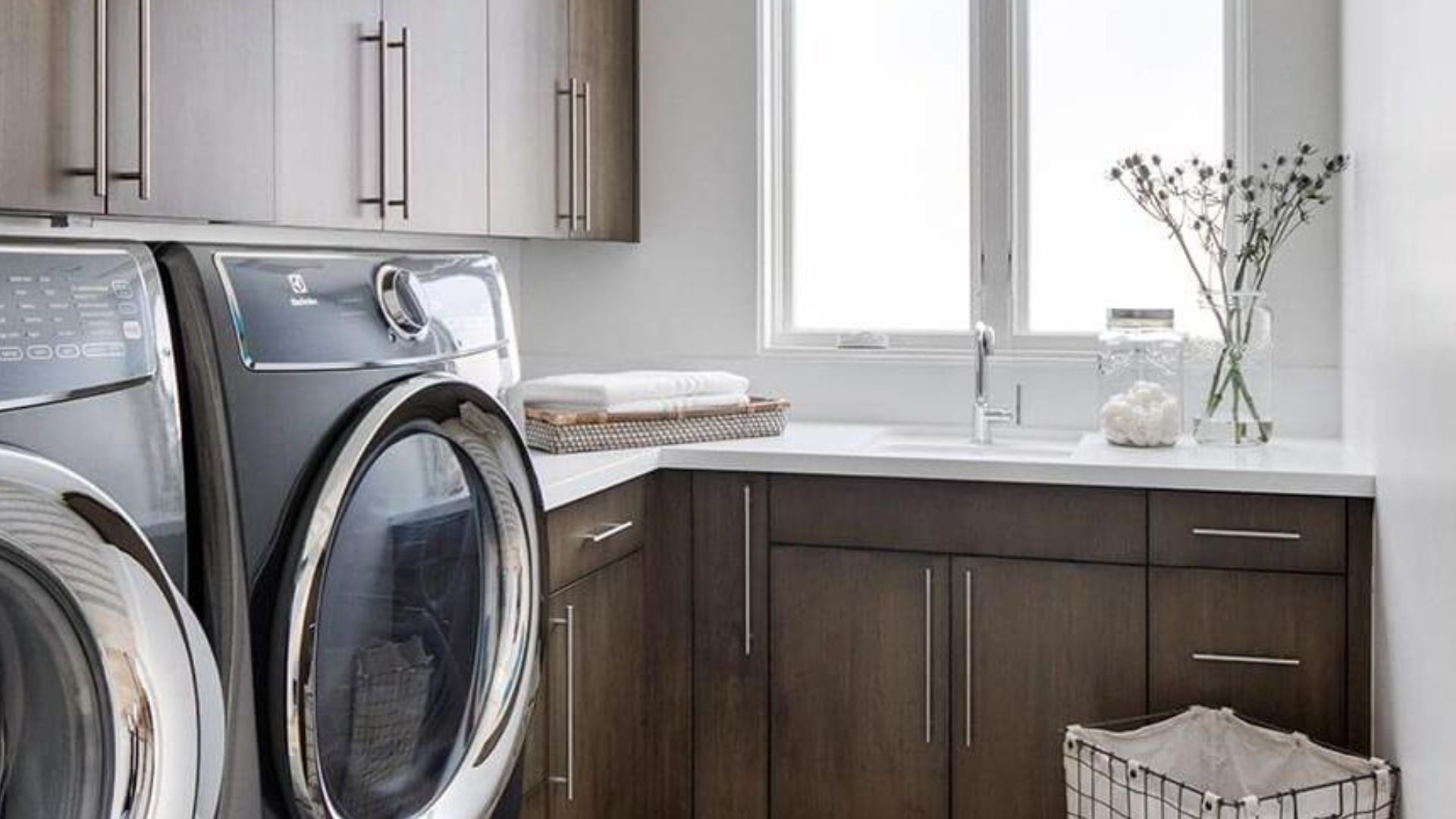 luxurious laundry room with cabinets