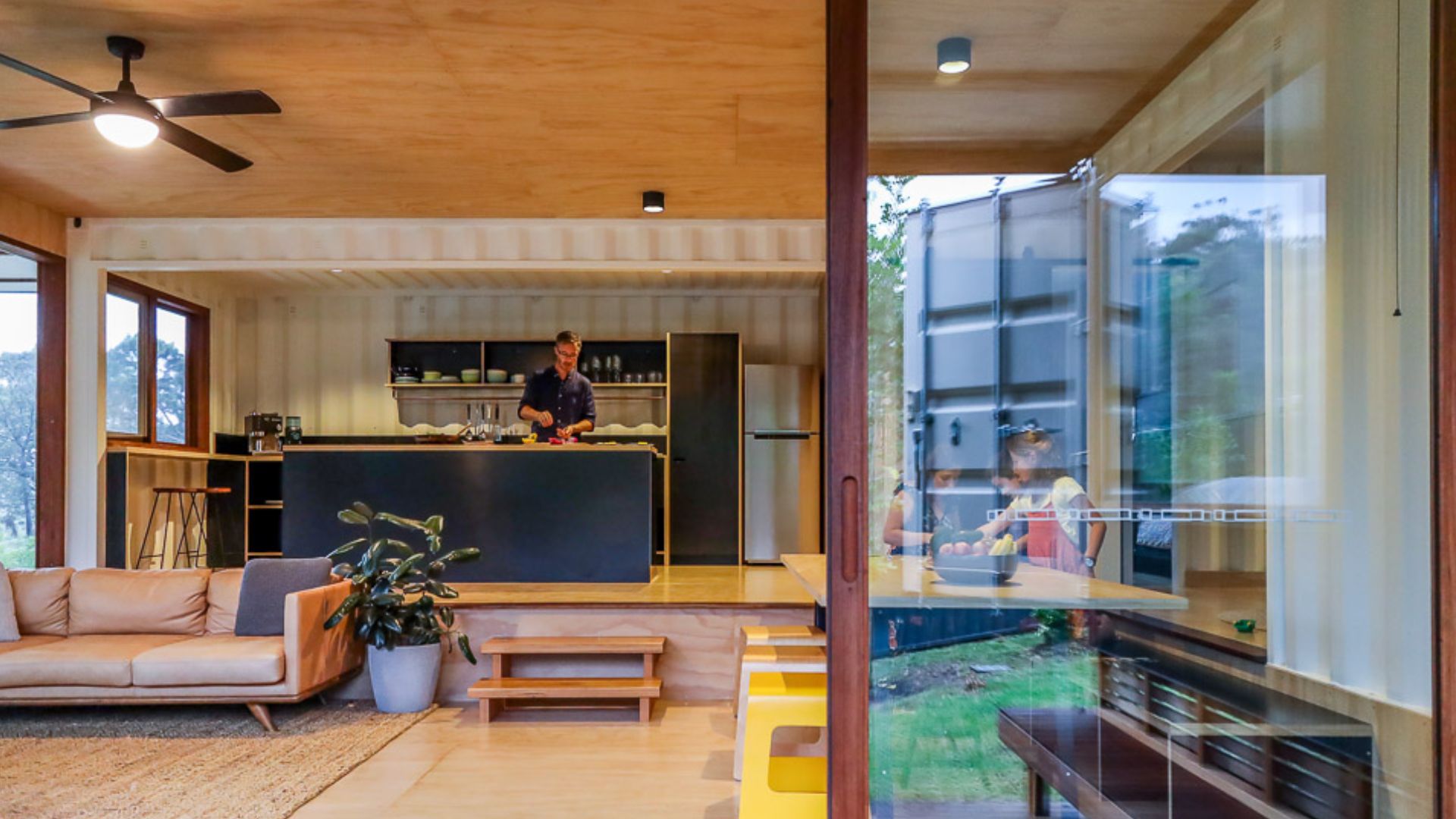 open space of living room with the kitchen beind it