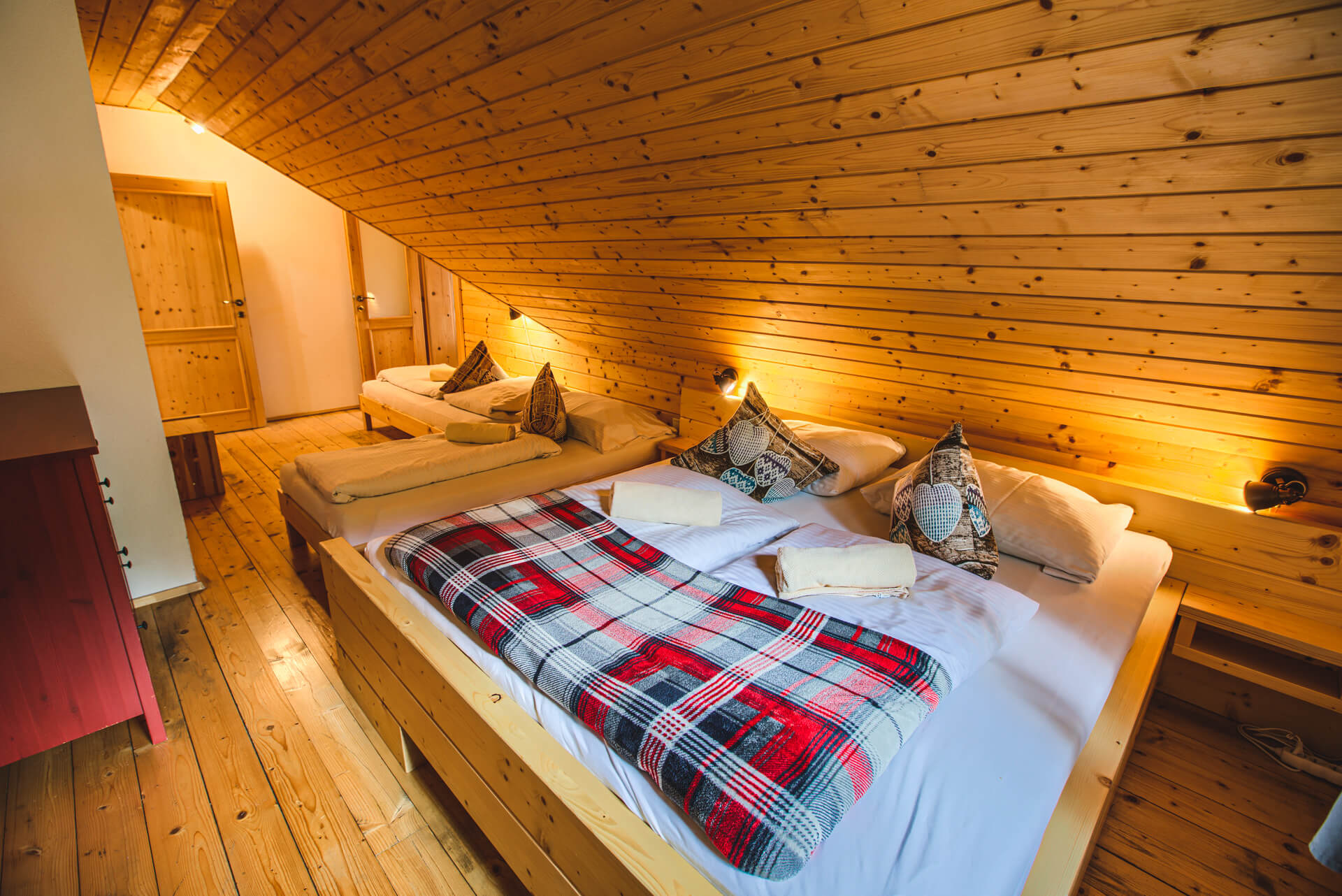 Large and cozy bedroom in cabin with four beds