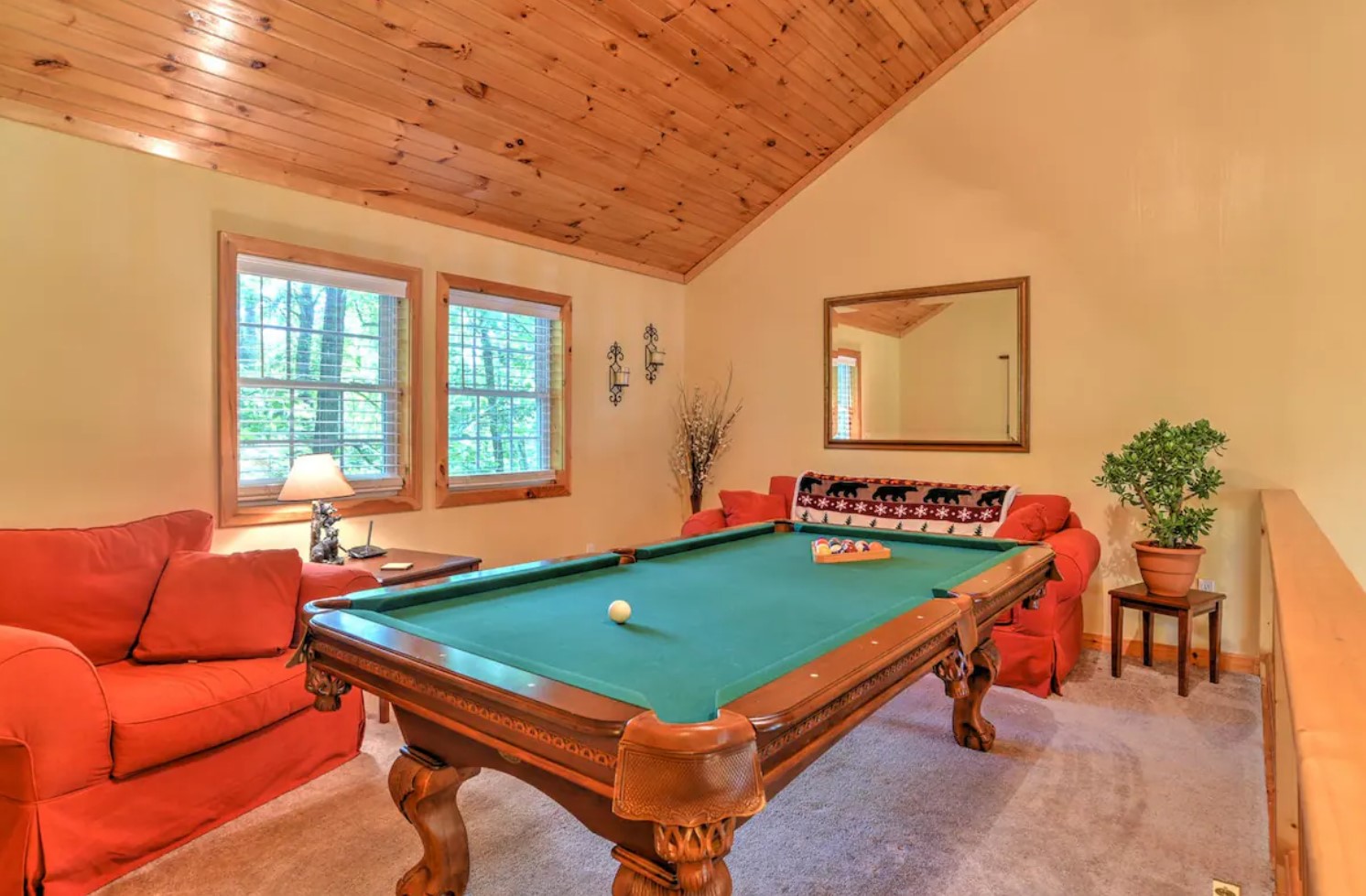 loft with a pool table and a lounge area