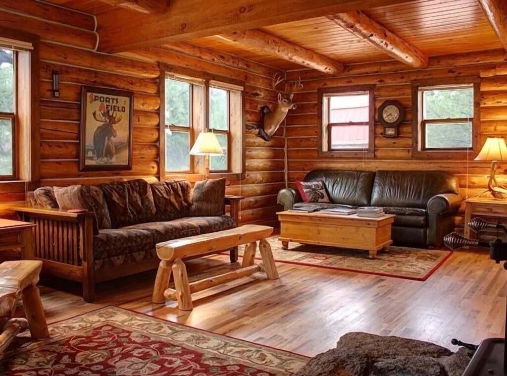 Living room with a leather couch and wooden coffee tables