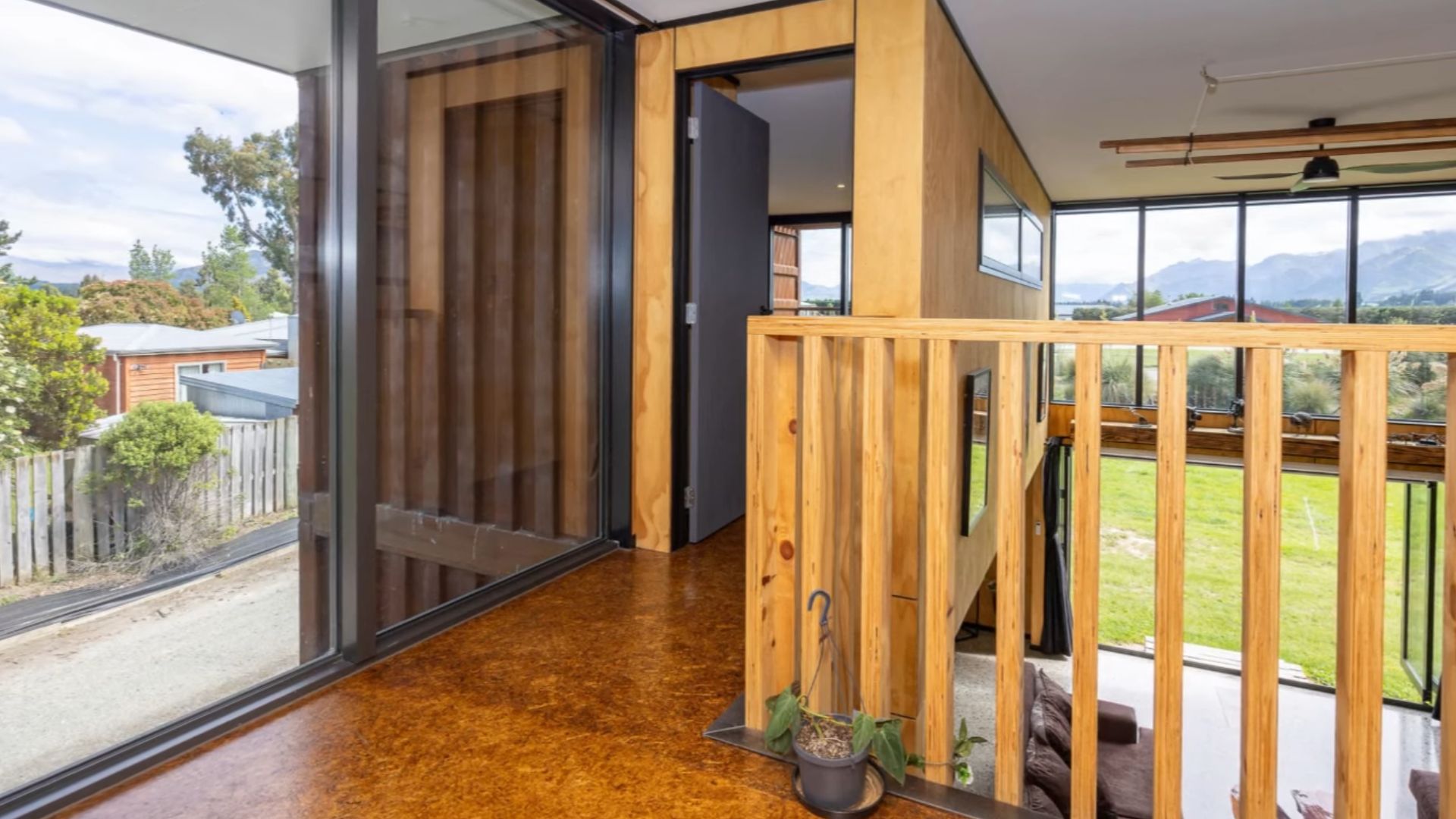 hallway on the second level with wooden details