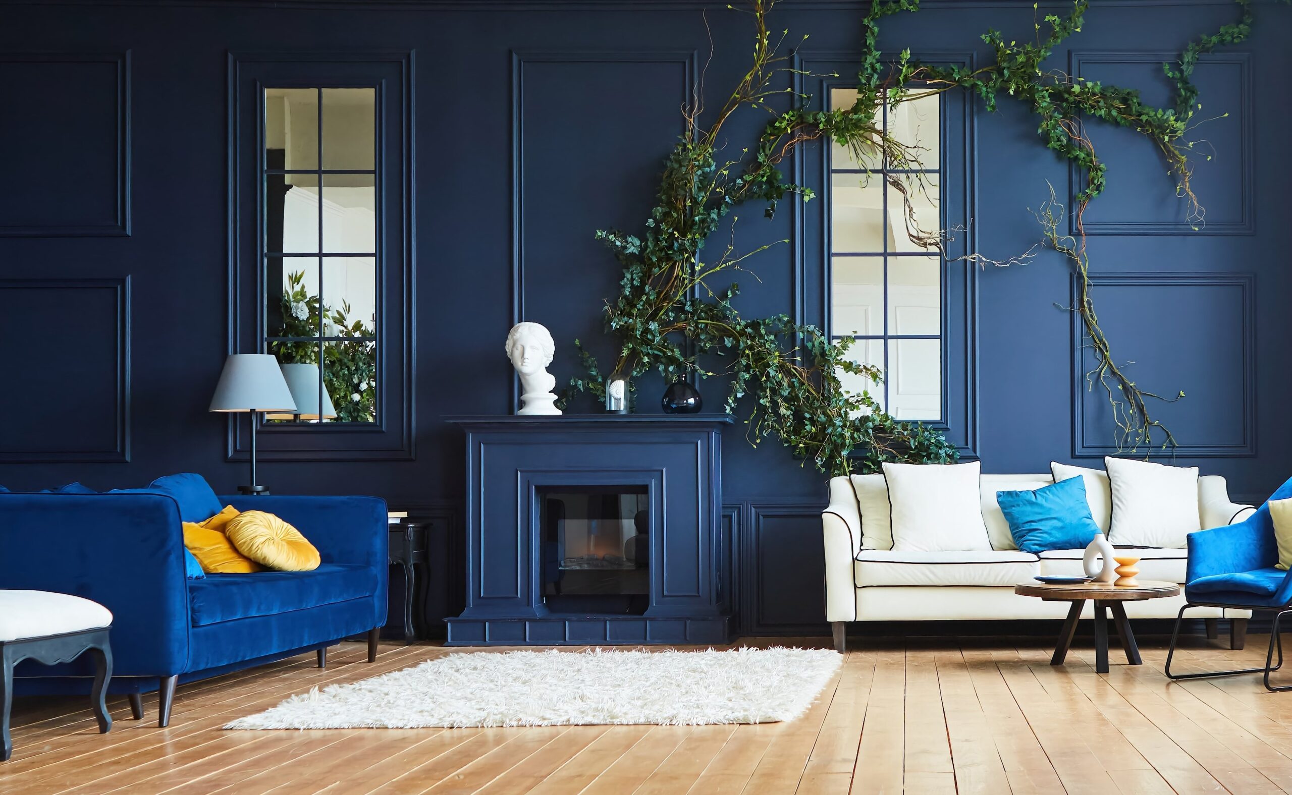 luxurious living room with mirrors and a plant