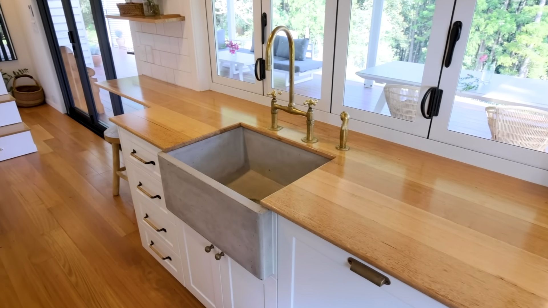 beautiful white and wooden kitchen with brass details