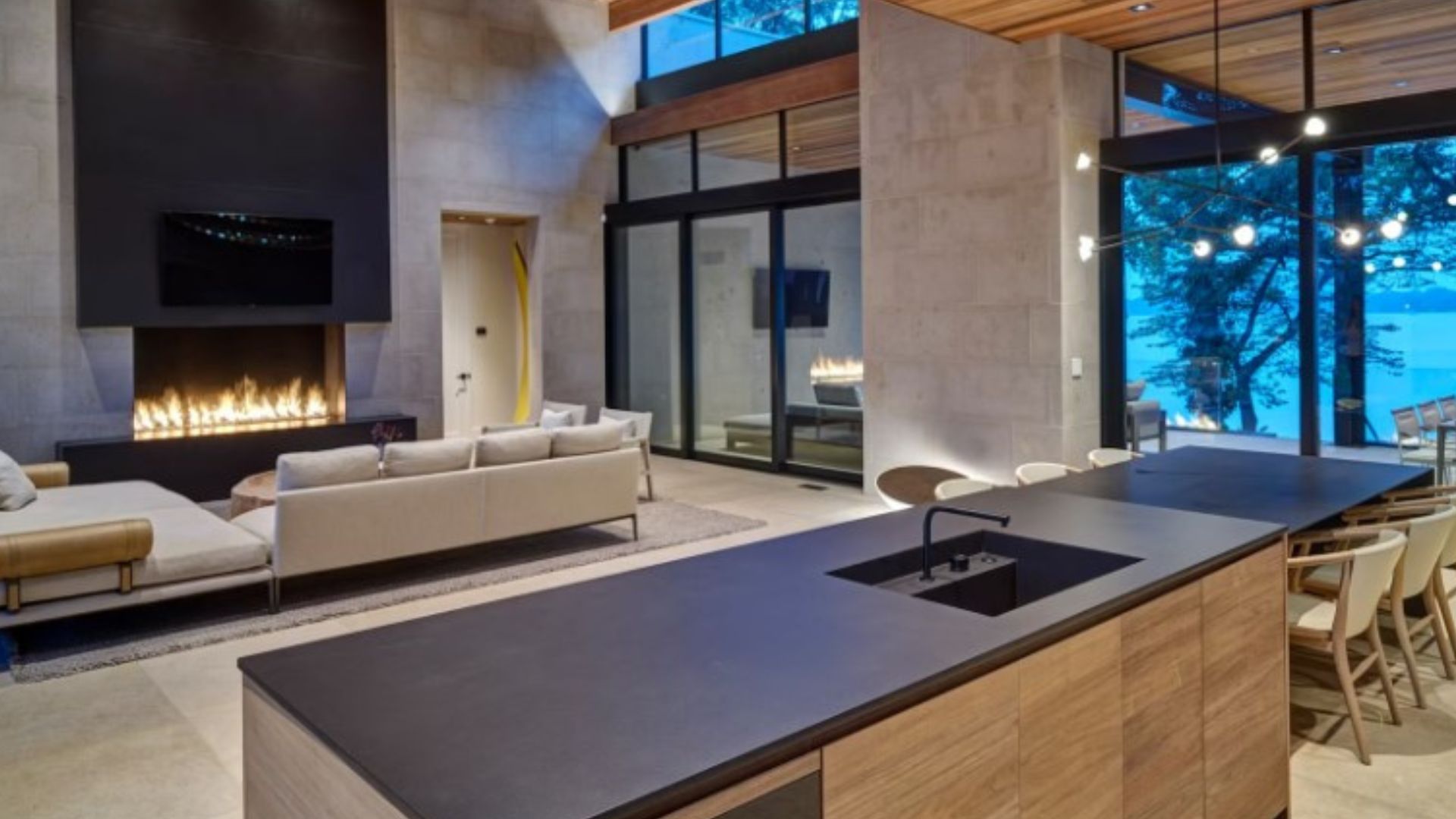 modern kitchen island and living room in the back