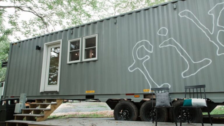 Container home on wheels with a porch