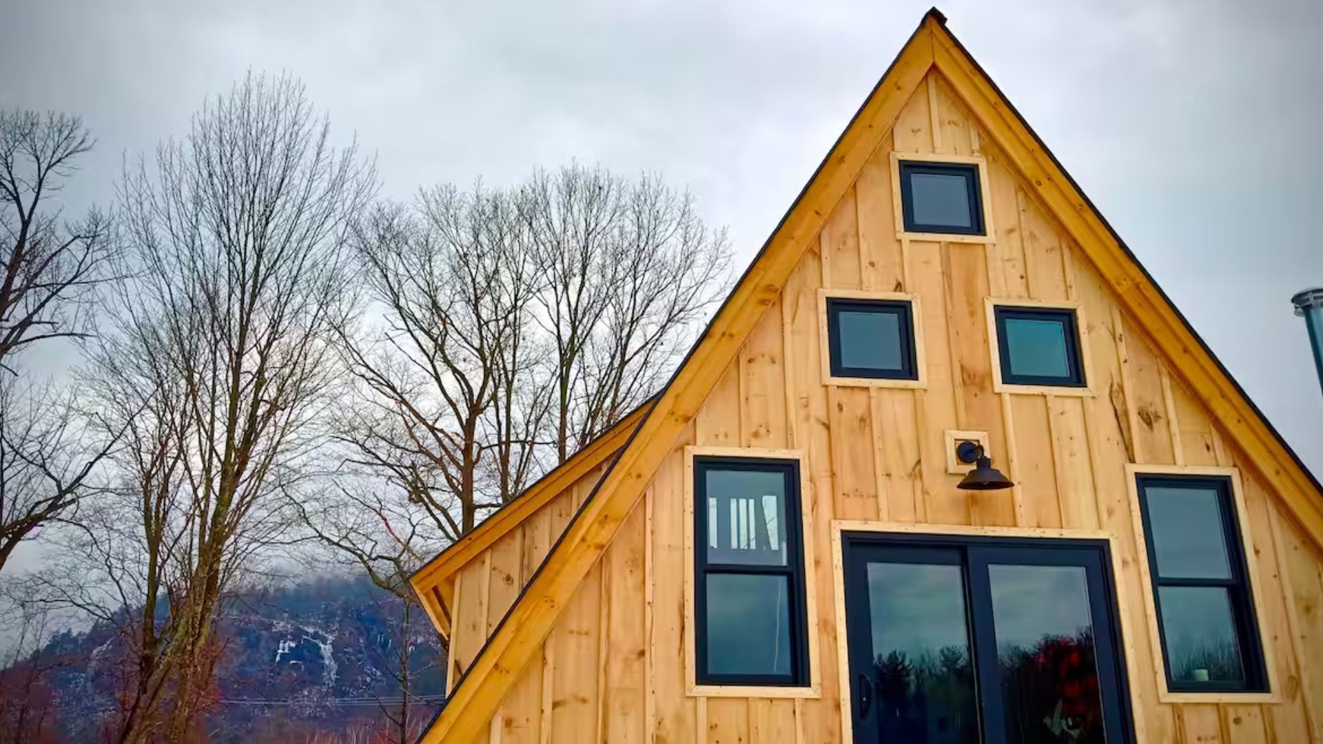 A-frame cabin with a lot of windows