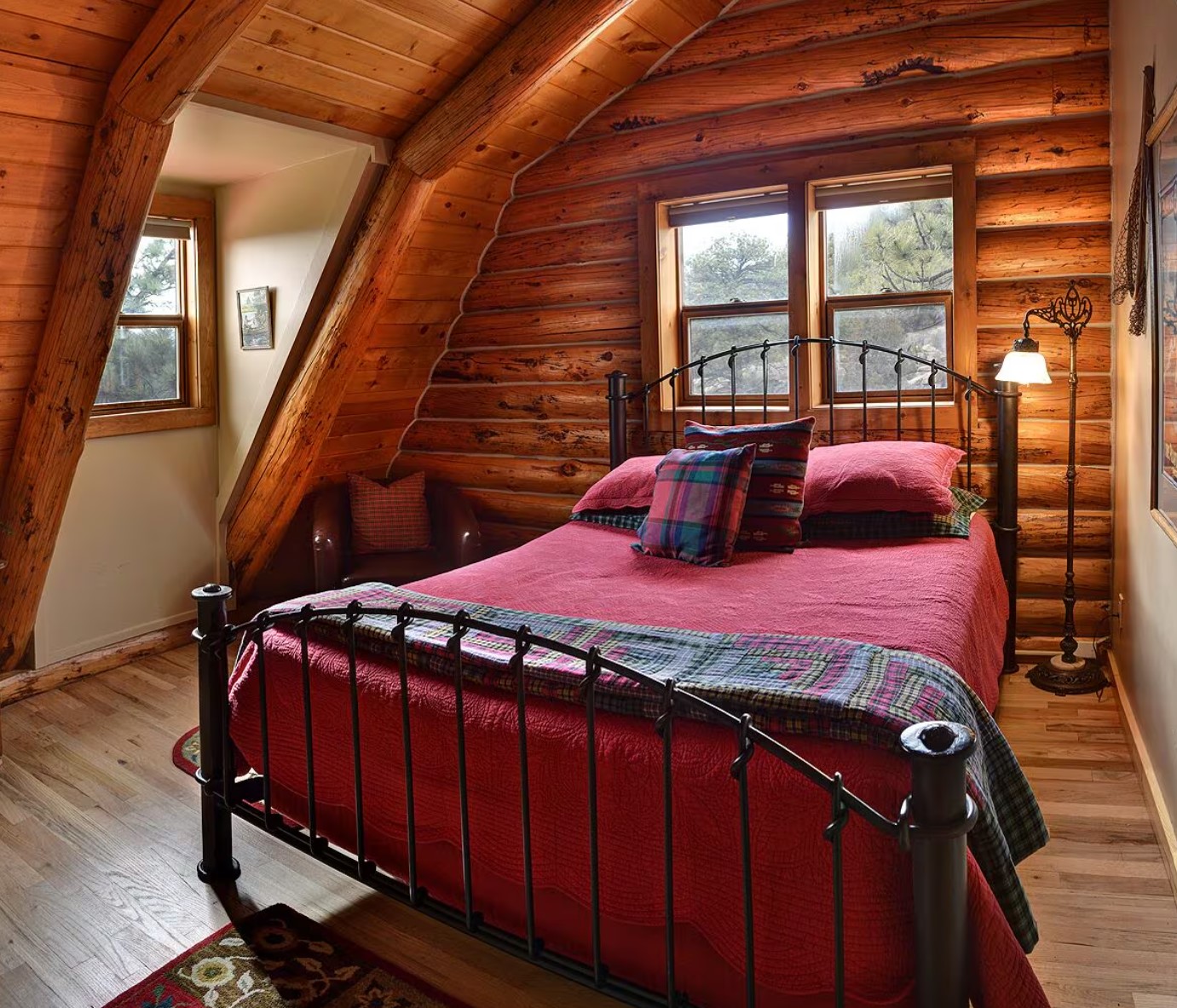 Queen-sized bedroom with a red metal bed