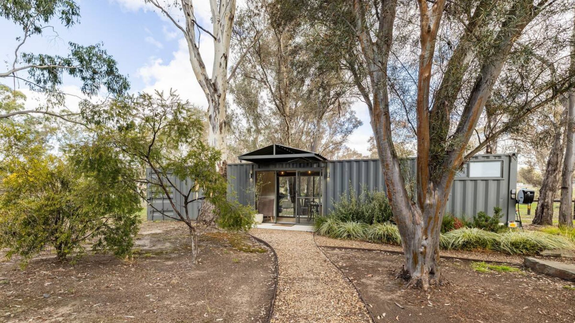 Luxurious shipping container with an incredible backyard