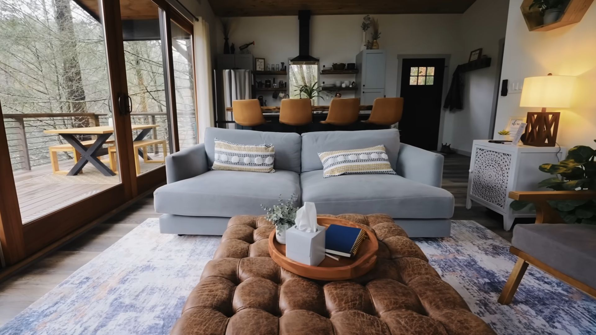 beautiful living room with a cool coffee table and picture windows