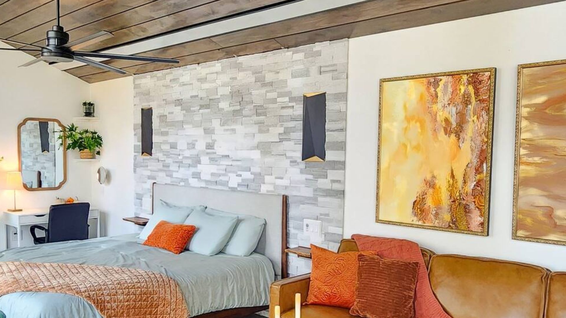 accent stone wall behind the bed