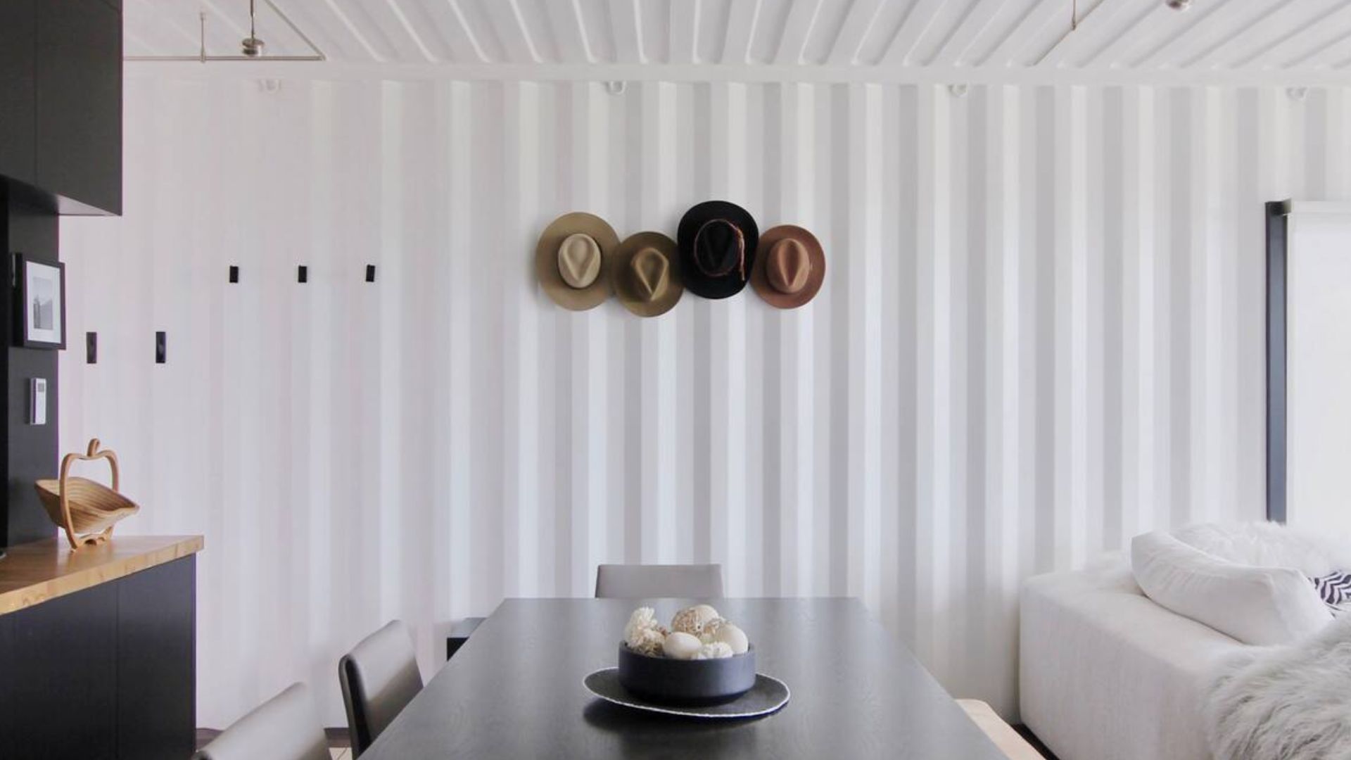 dining area with hats on the wall