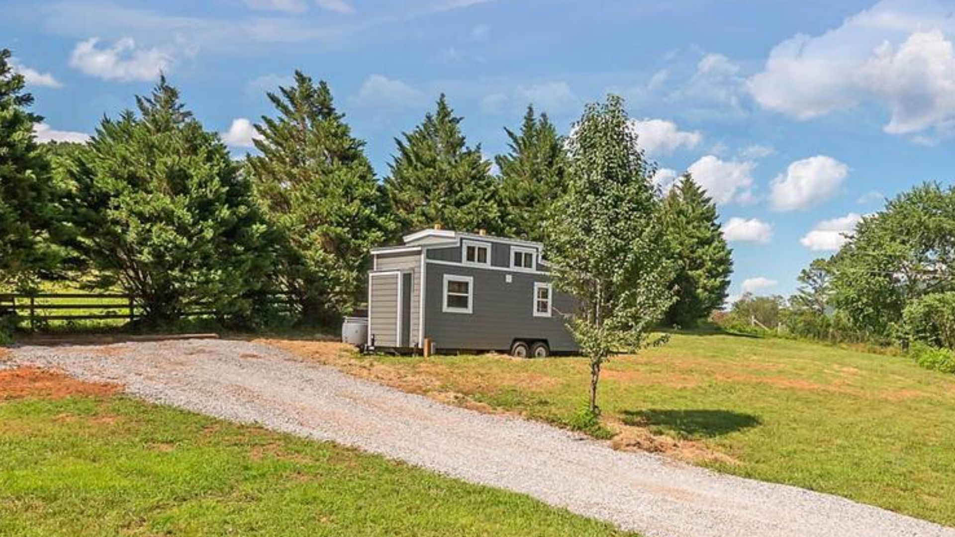 Exterior of tiny house with a lot of windows