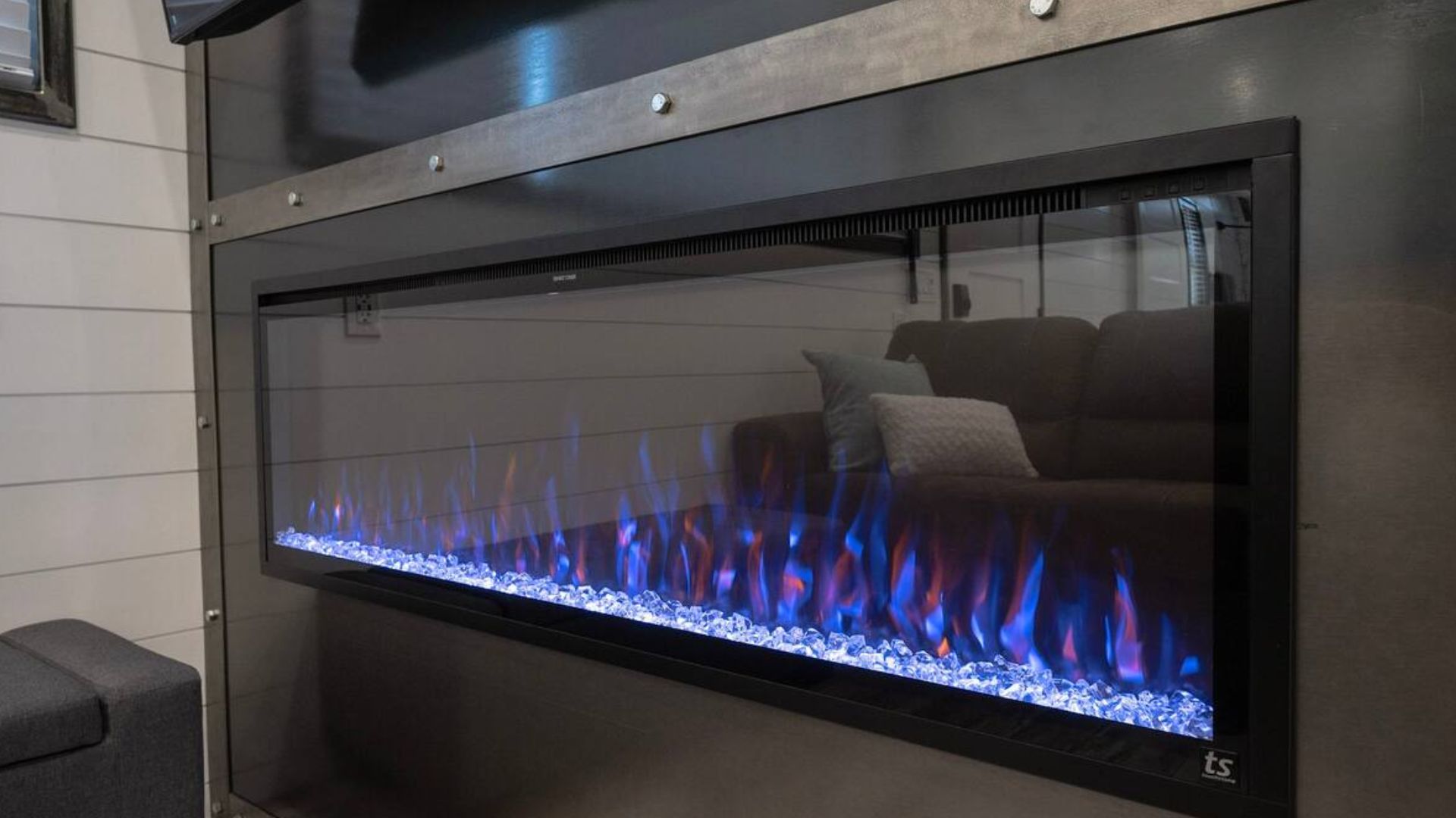 stunnin black fireplace with blue flame