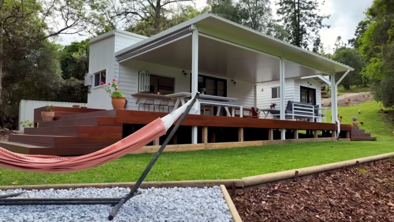 exterior of a tiny home with a big deck