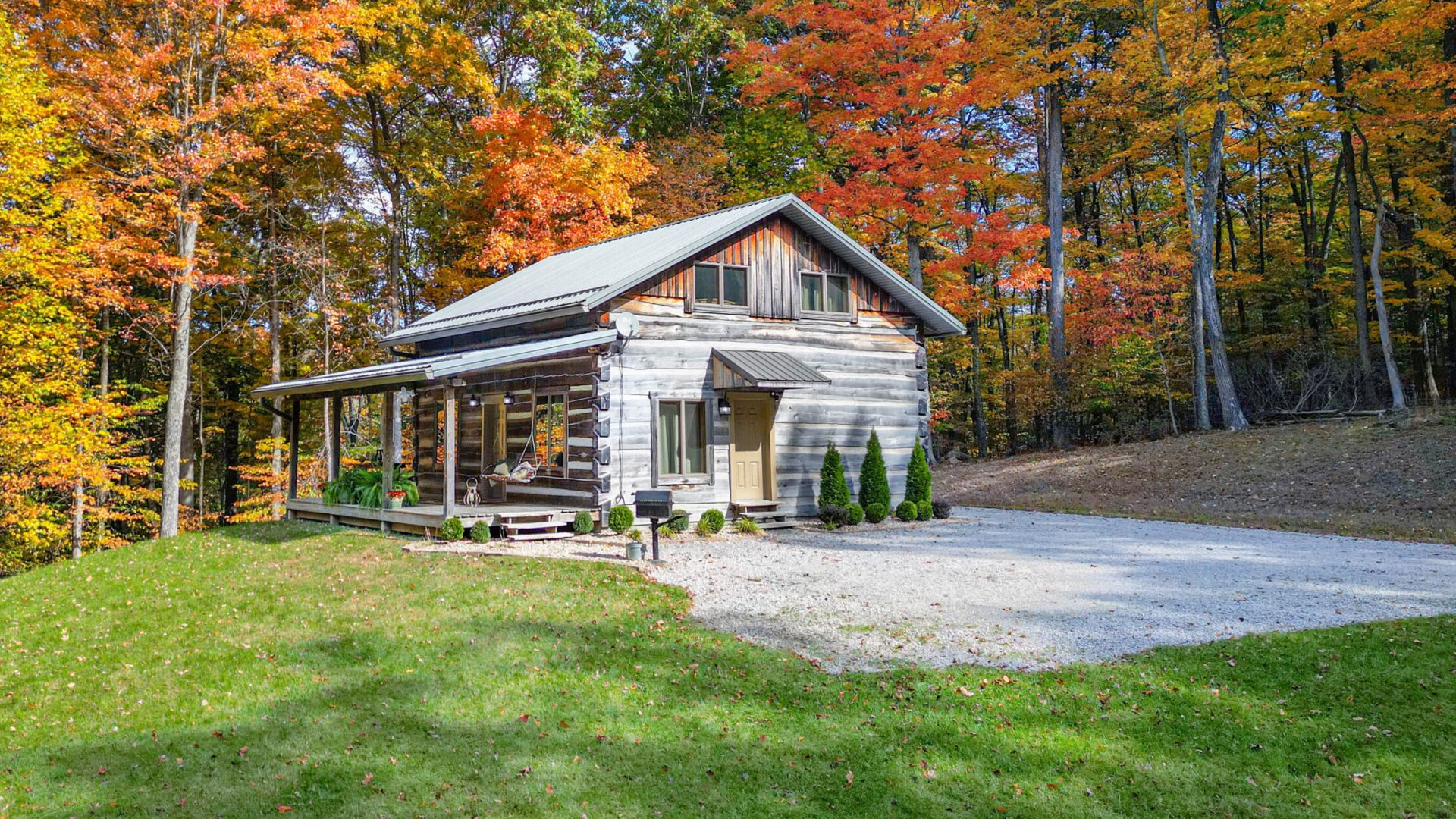 exterior of a cabin surrounded by nature