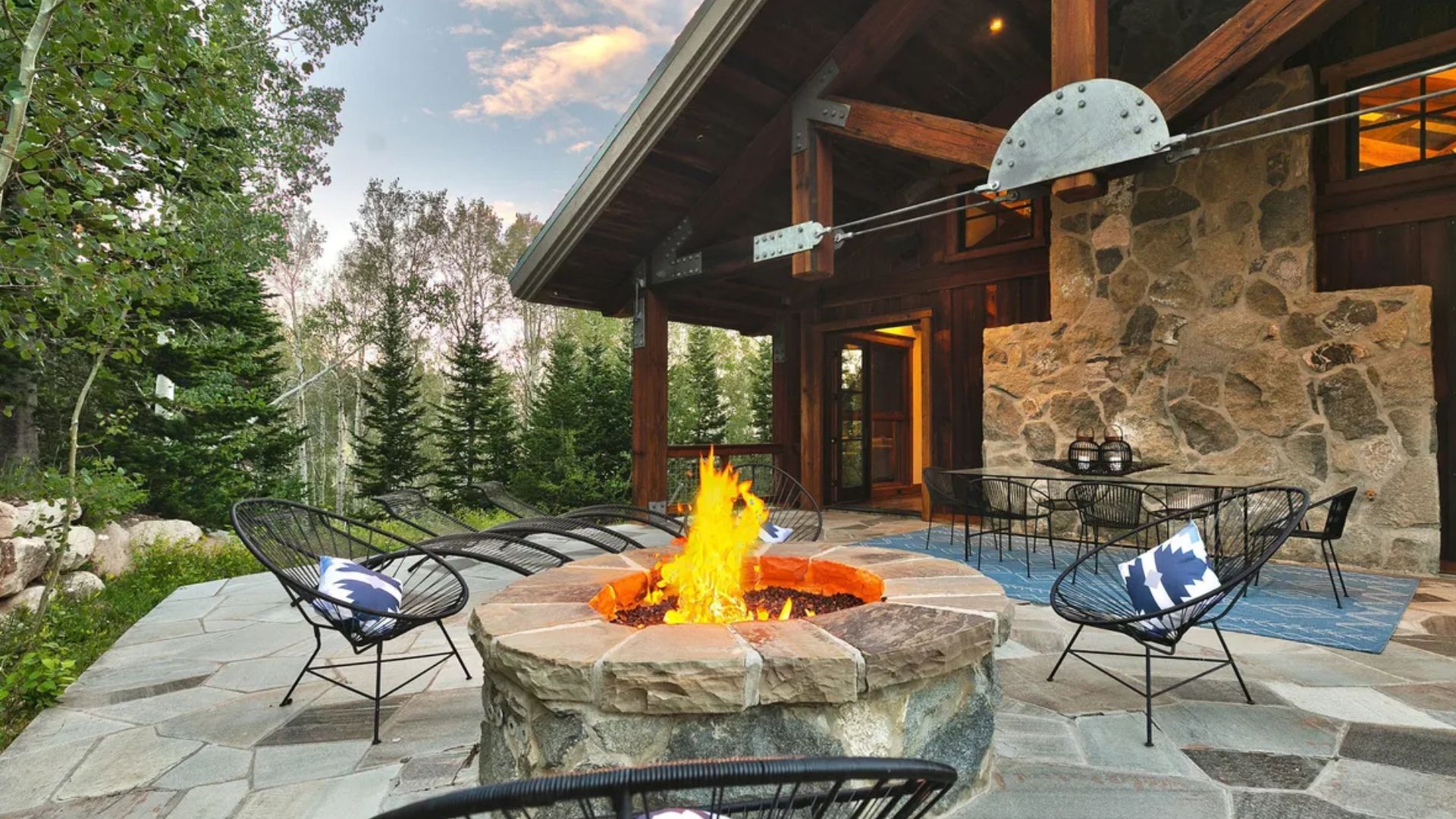 fire pit lounge outside a beautiful mansion