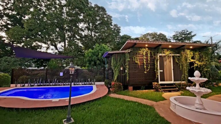 Wooden container home with a pool