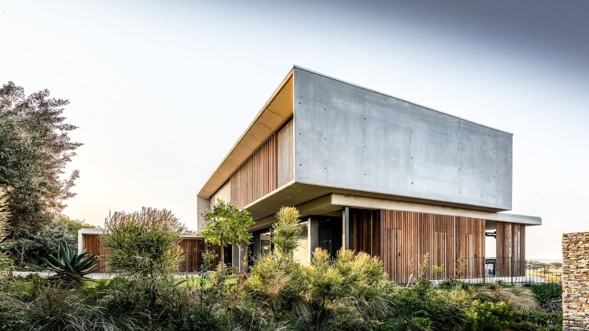 forest house with concrete and wooden elements