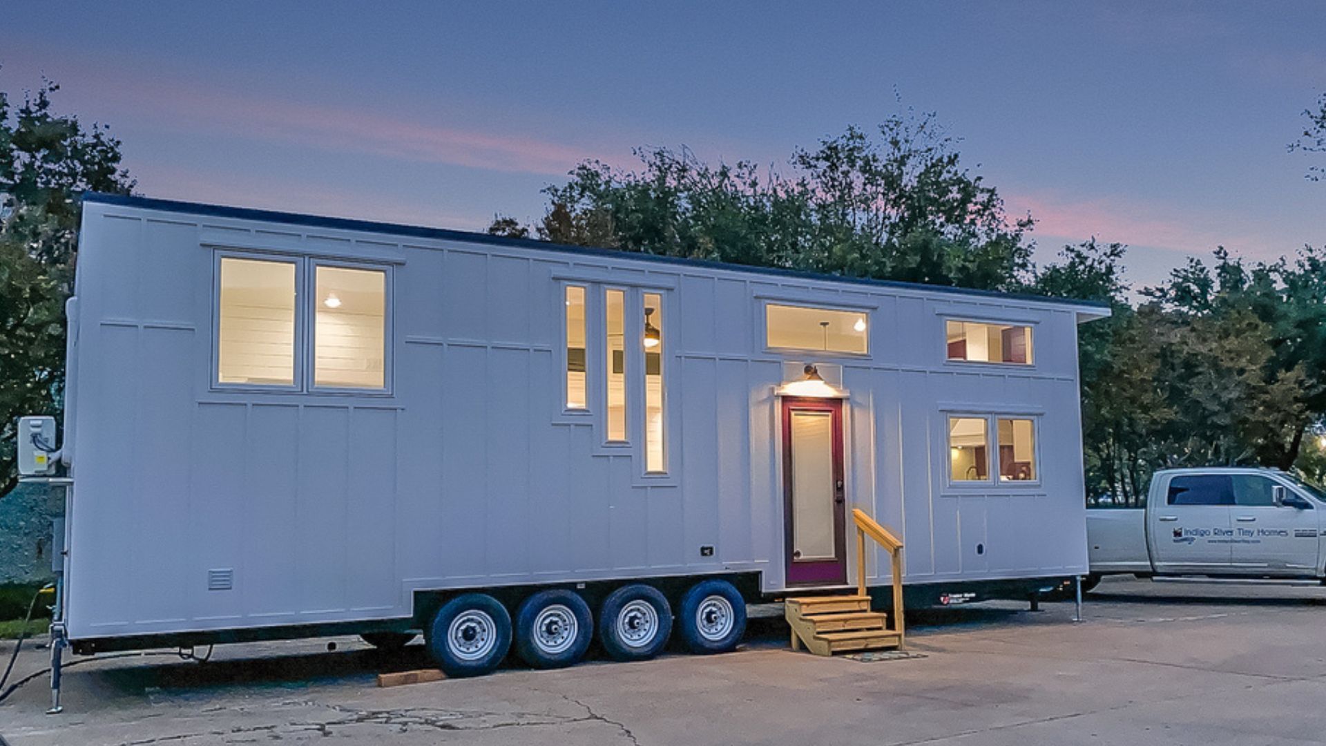 exterior of a tiny home on wheels with white exterior