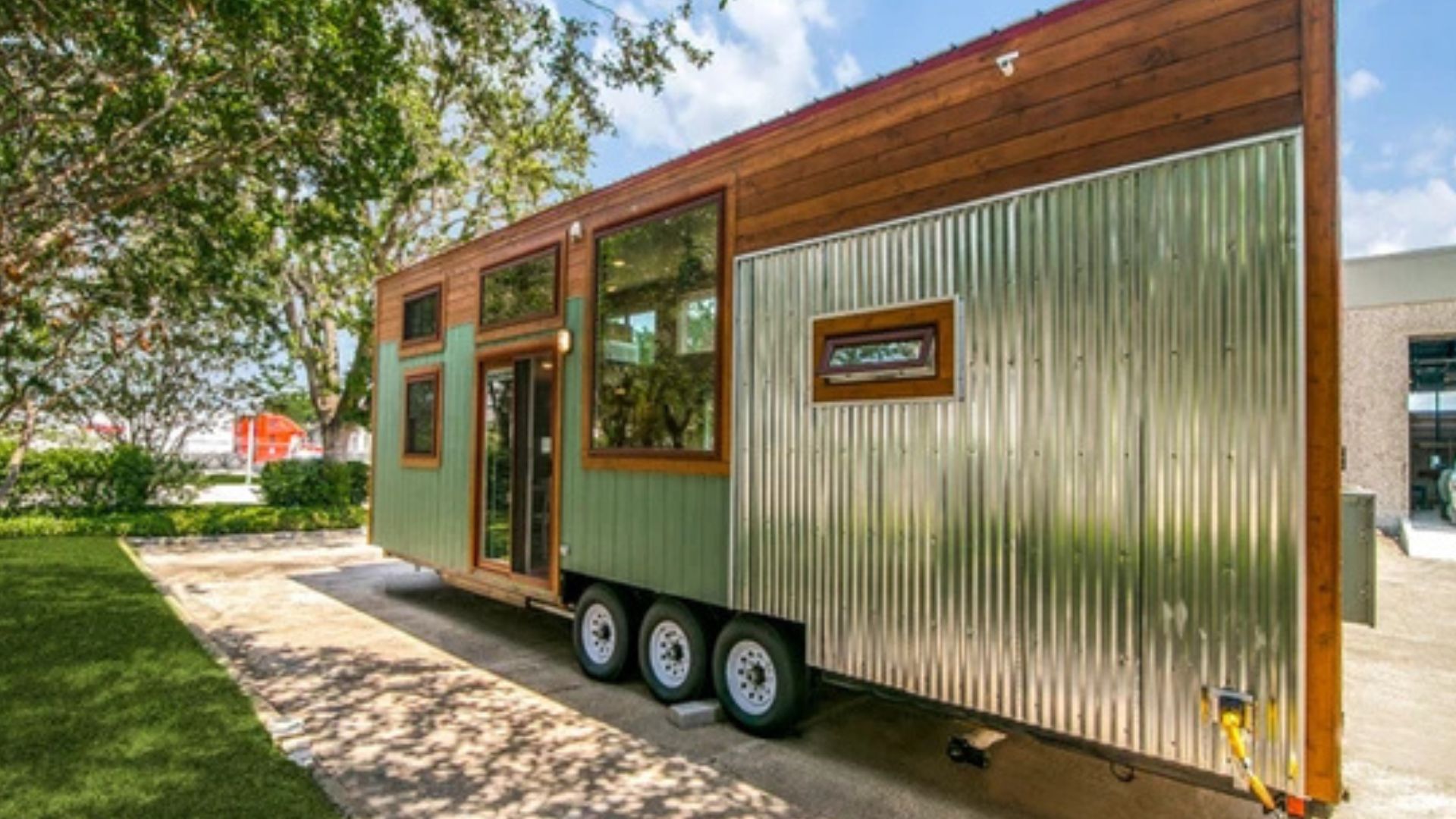 side view of the big bertha thow with blue and cedar siding and metal siding in the left corner