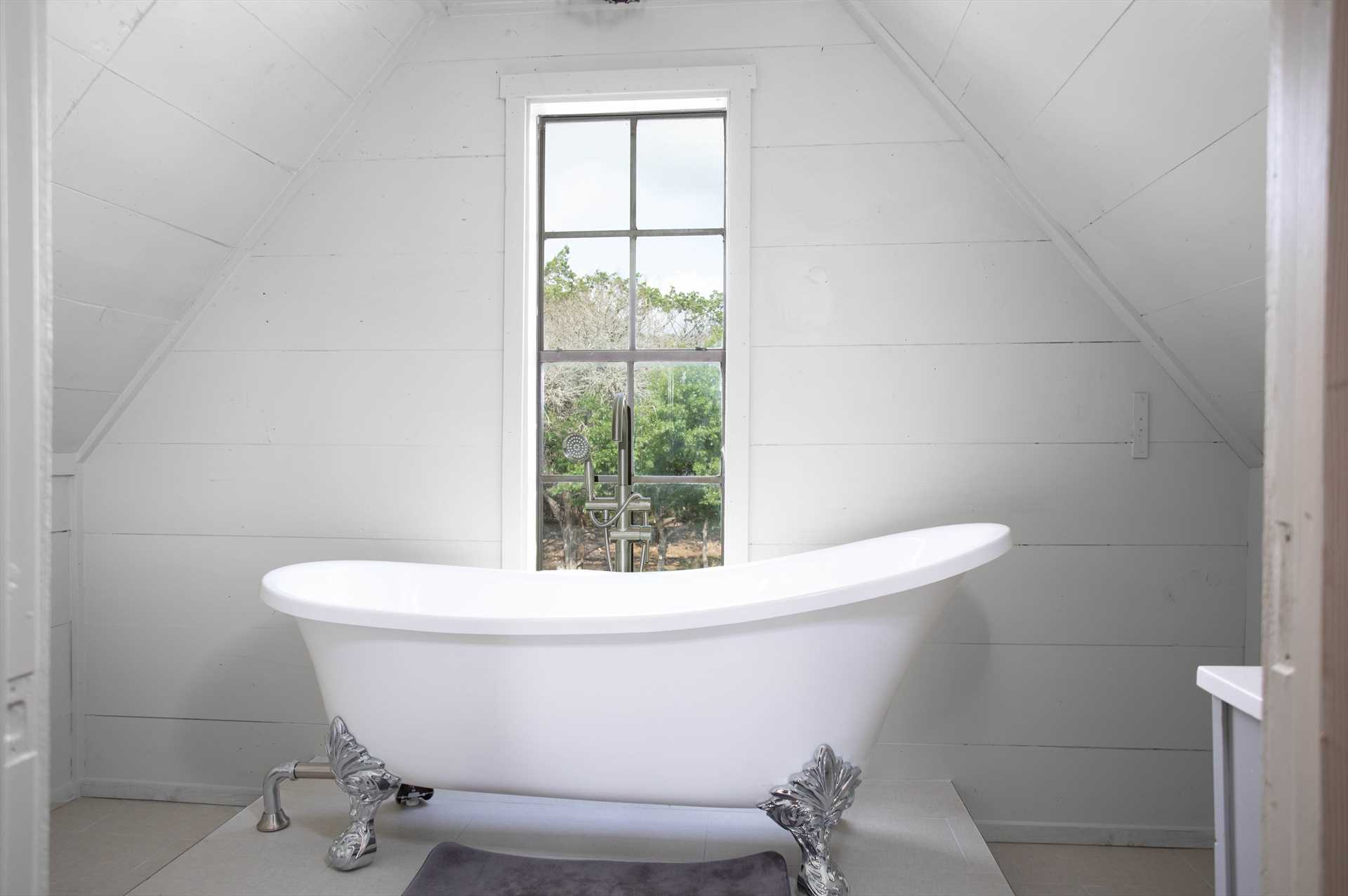 Sleek bathroom with a tub and a window