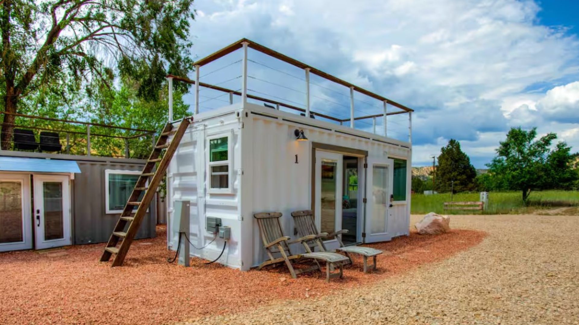 exterior of a white container with a roof terrace