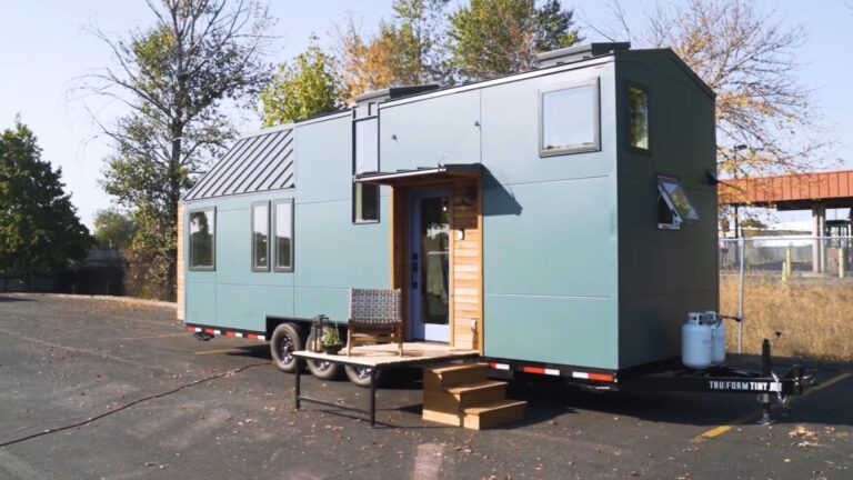 greyish-blue exterior of a tiny cozy thow