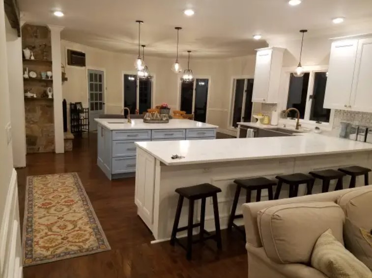 dining room with a white table and black chairs after renovation