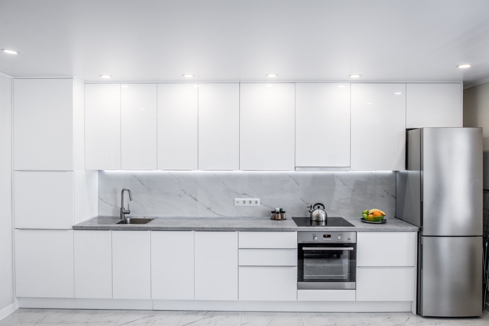 kitchen with white cabinets and white walls