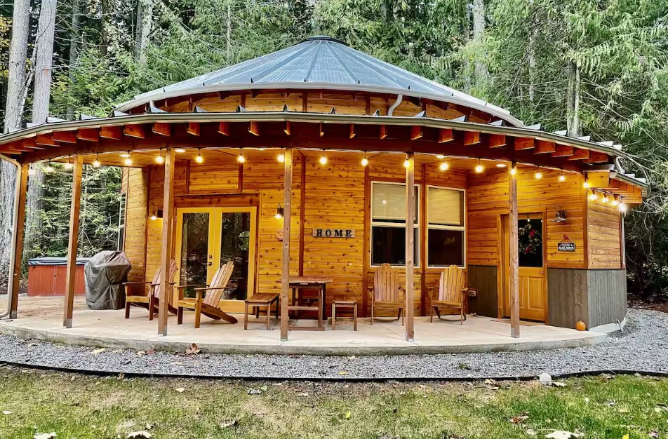 round wooden home in nature