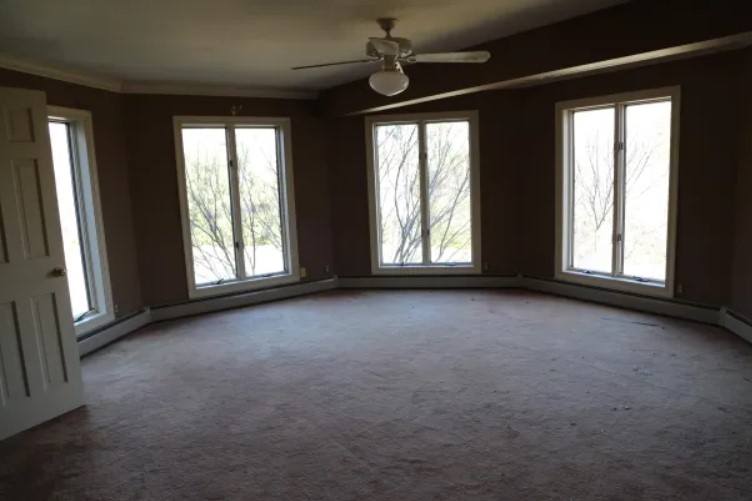 empty bedroom with big windows before renovation